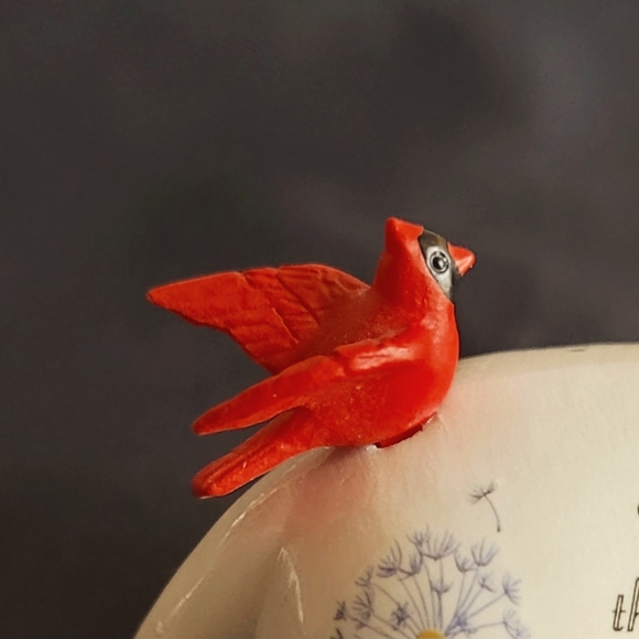 White Cat Looking Back at a Red Bird That Had Landed on His Back - Picture 8 of 12